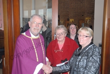 Father Harrington greets parishioners at St Patrick's Walsall